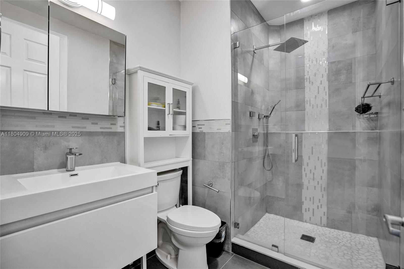10457 Laurel Road Davie, FL 33328 - Photo 46 of 96 a bathroom with a sink toilet and shower