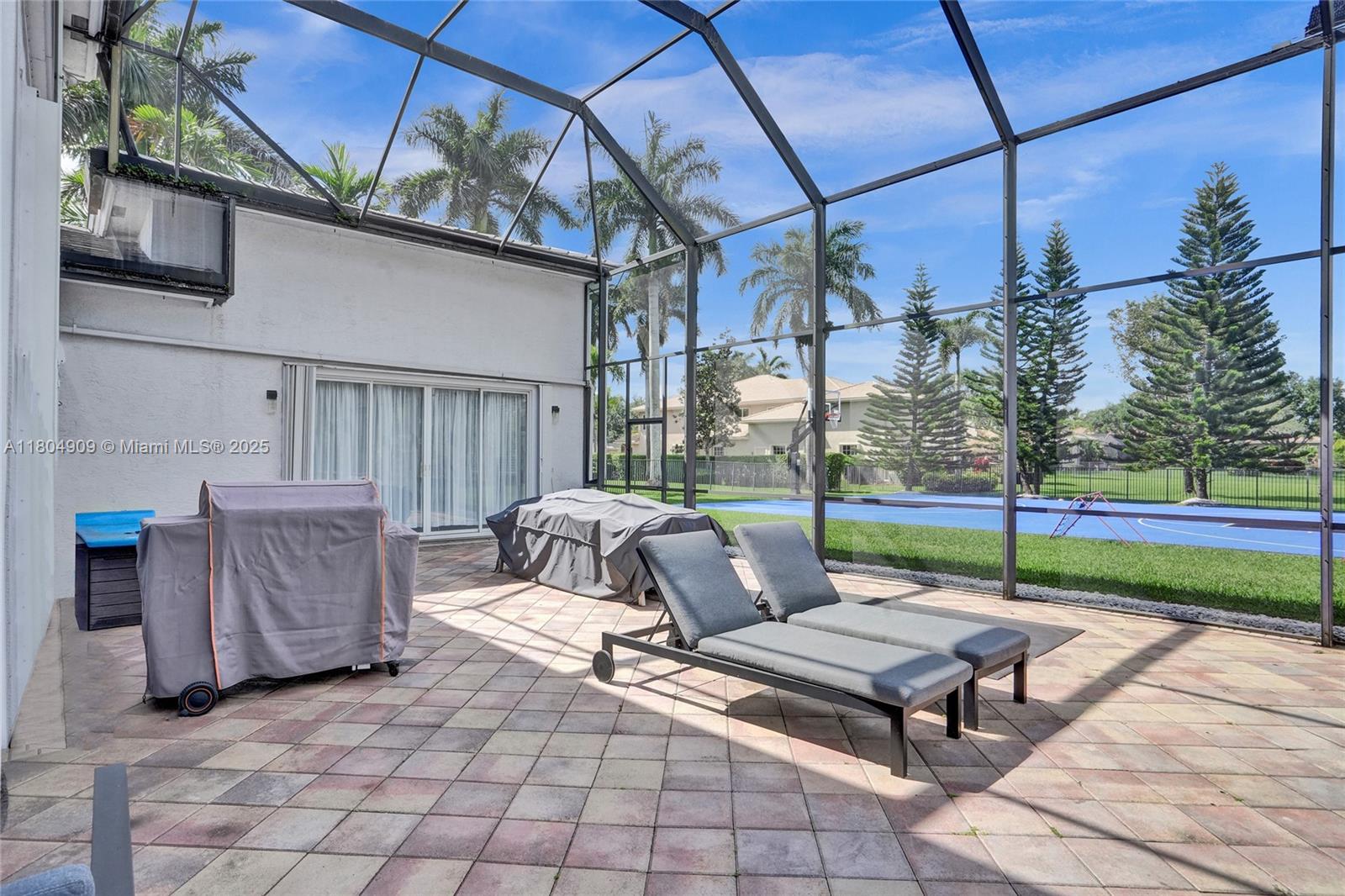 10457 Laurel Road Davie, FL 33328 - Photo 70 of 96 a view of a patio with a table and chairs