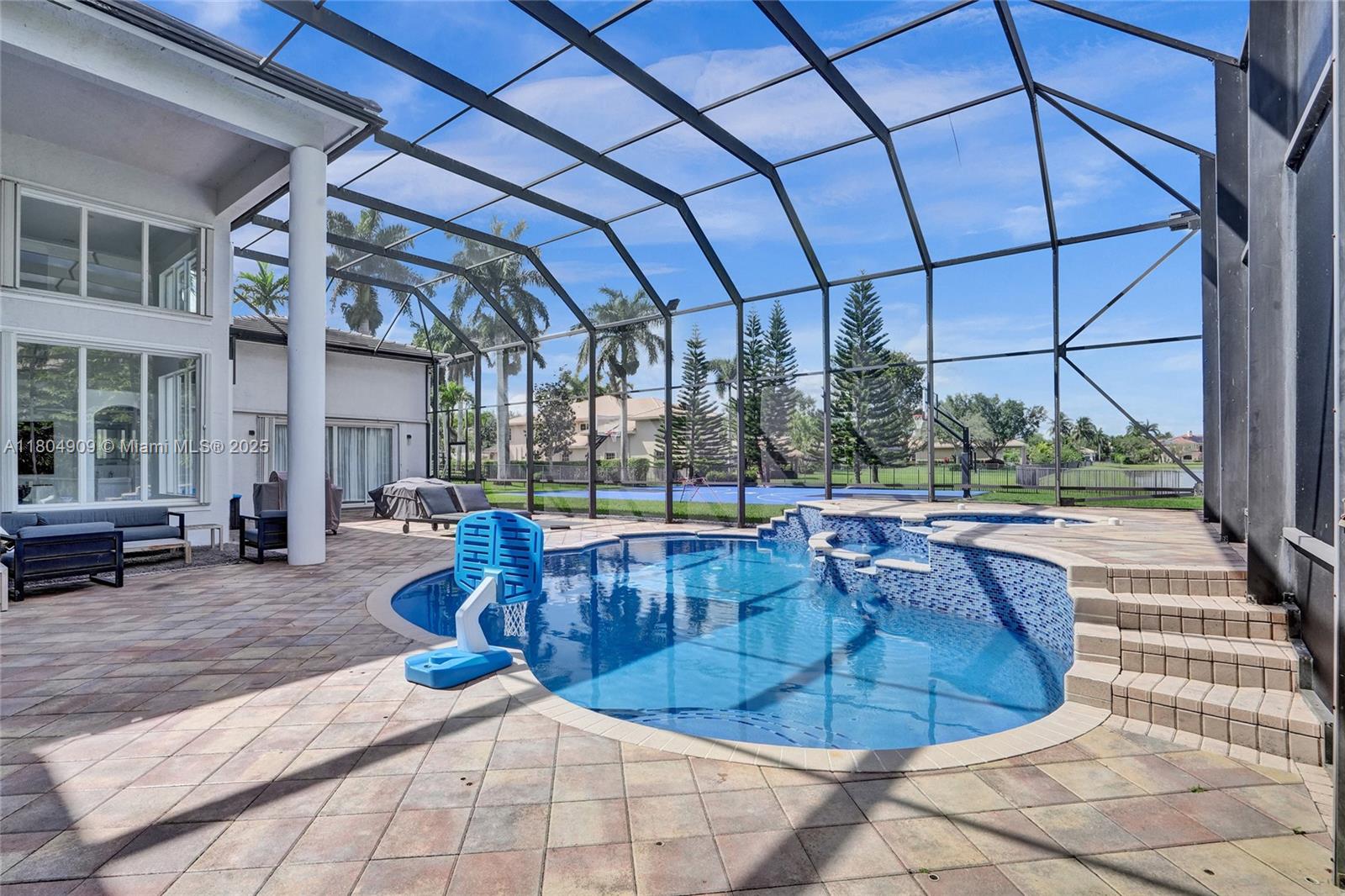 10457 Laurel Road Davie, FL 33328 - Photo 75 of 96 a view of a swimming pool with sitting area