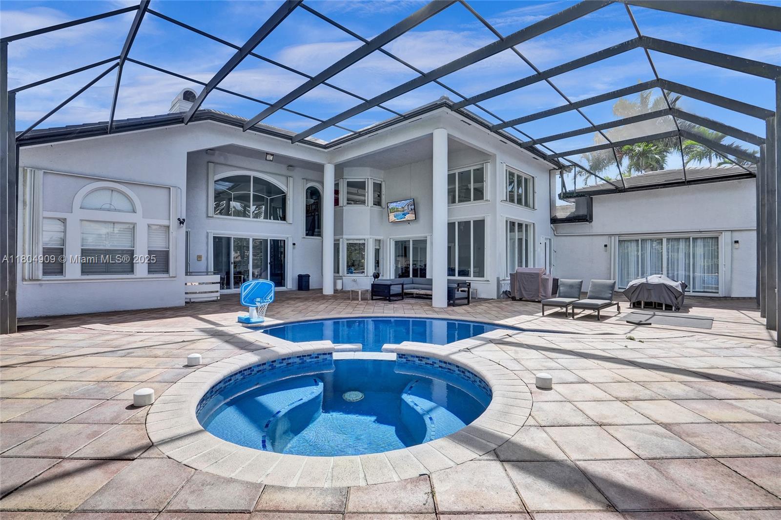 10457 Laurel Road Davie, FL 33328 - Photo 76 of 96 a view of a house with swimming pool and sitting area