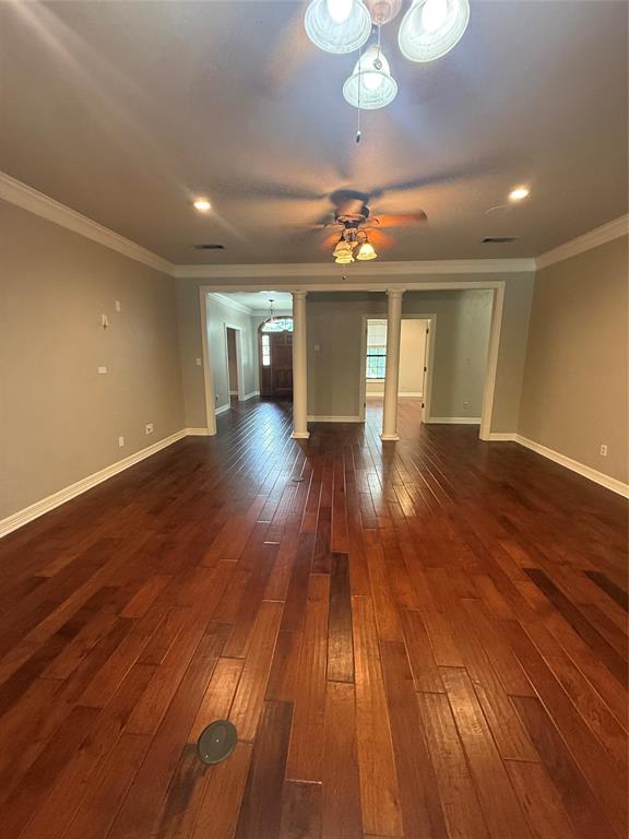 201 Woodhaven Drive Minden, LA 71055 - Photo 4 of 31 Spacious living area featuring rich wood-finish flooring, recessed lighting, and crown molding