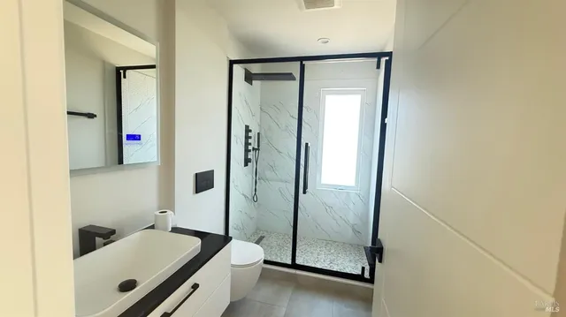 a bathroom with a tub and a sink