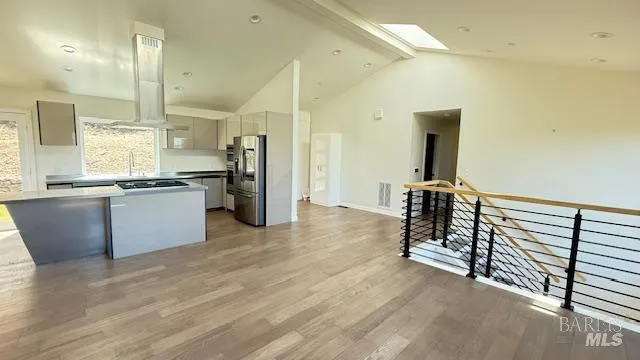a view of a kitchen with a sink and a window