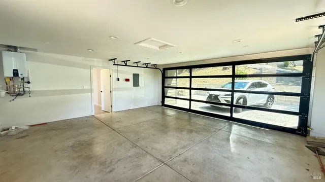 a view of a livingroom with an empty space and window