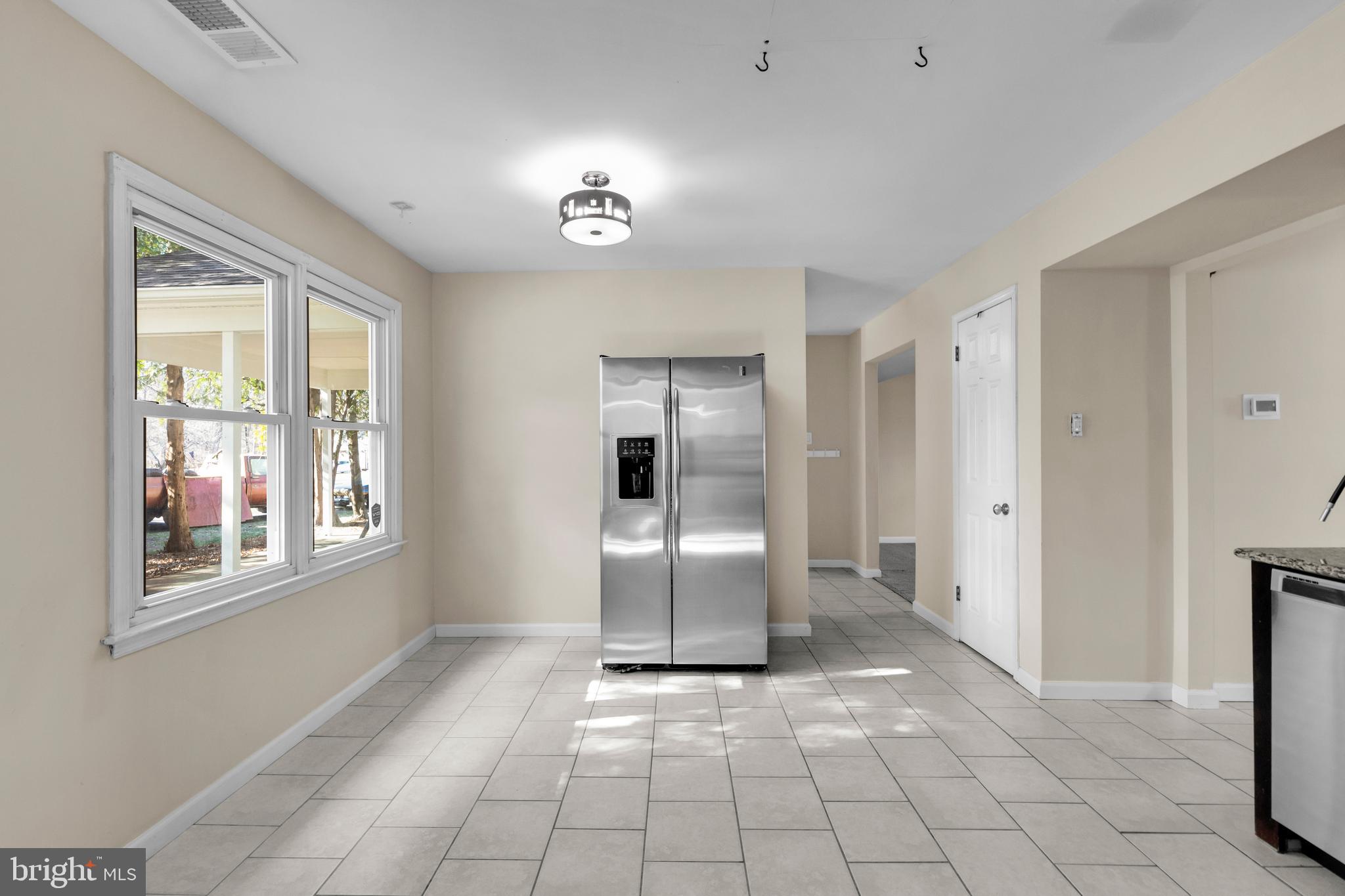 2773 Anvil Place Doylestown, PA 18902 - Photo 11 of 36 a view of an empty room with window and cabinet