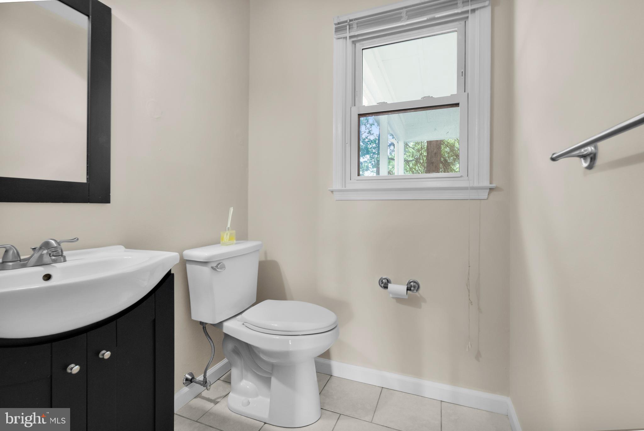 2773 Anvil Place Doylestown, PA 18902 - Photo 12 of 36 a bathroom with a sink a toilet and window