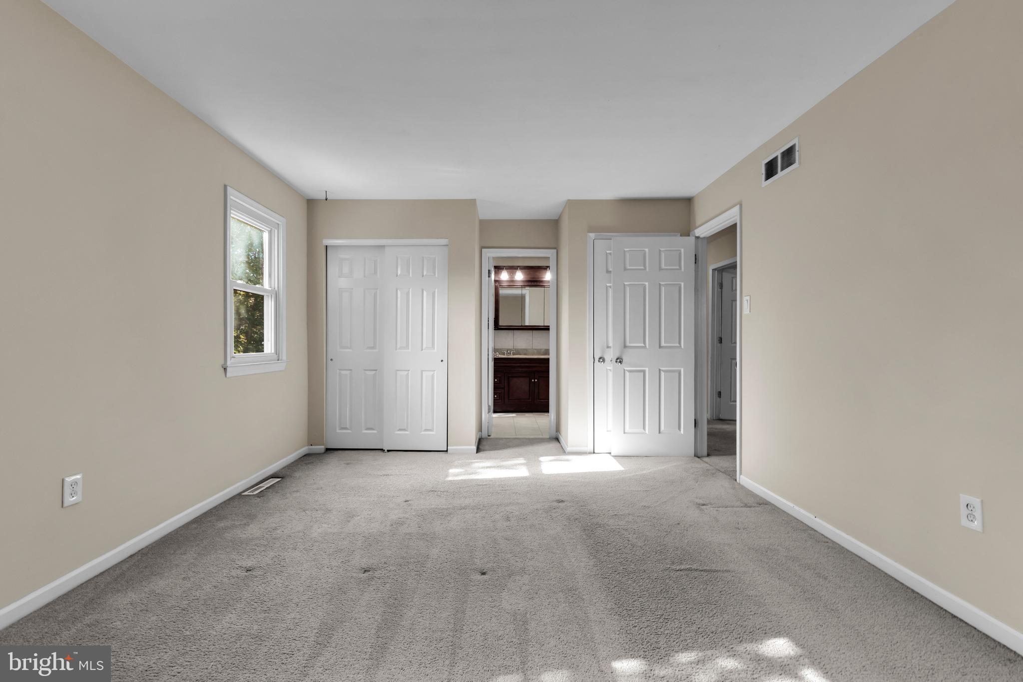 2773 Anvil Place Doylestown, PA 18902 - Photo 17 of 36 a view of an empty room with a fireplace and a window