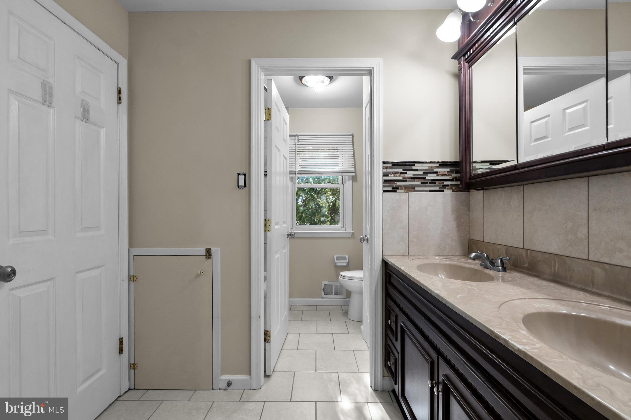 2773 Anvil Place Doylestown, PA 18902 - Photo 19 of 36 a bathroom with a sink and a mirror