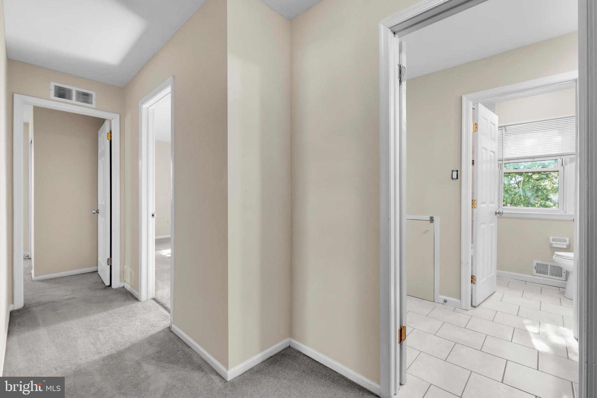 2773 Anvil Place Doylestown, PA 18902 - Photo 26 of 36 a view of a livingroom with wooden floor and a bathroom