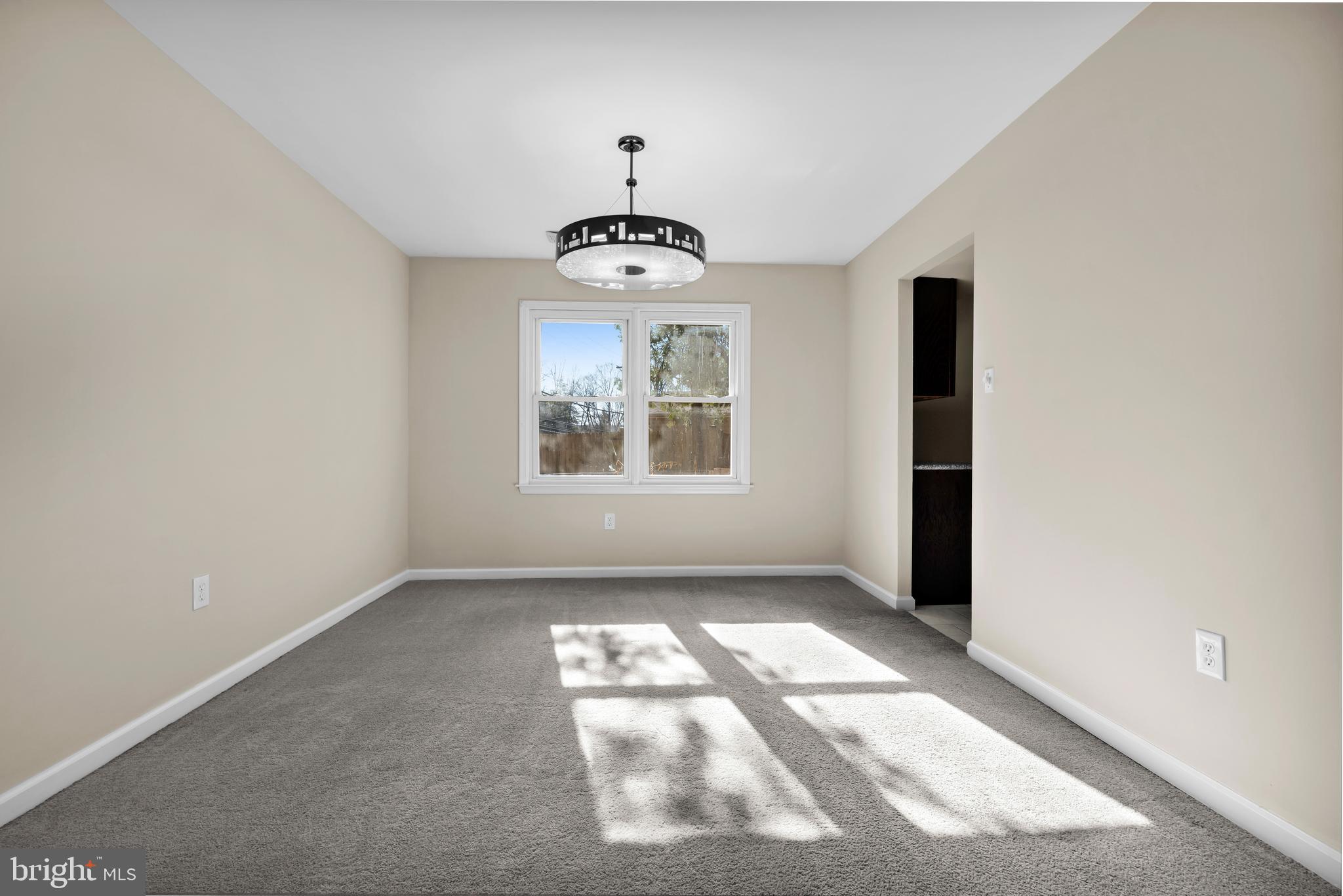 2773 Anvil Place Doylestown, PA 18902 - Photo 8 of 36 an empty room with windows and chandelier