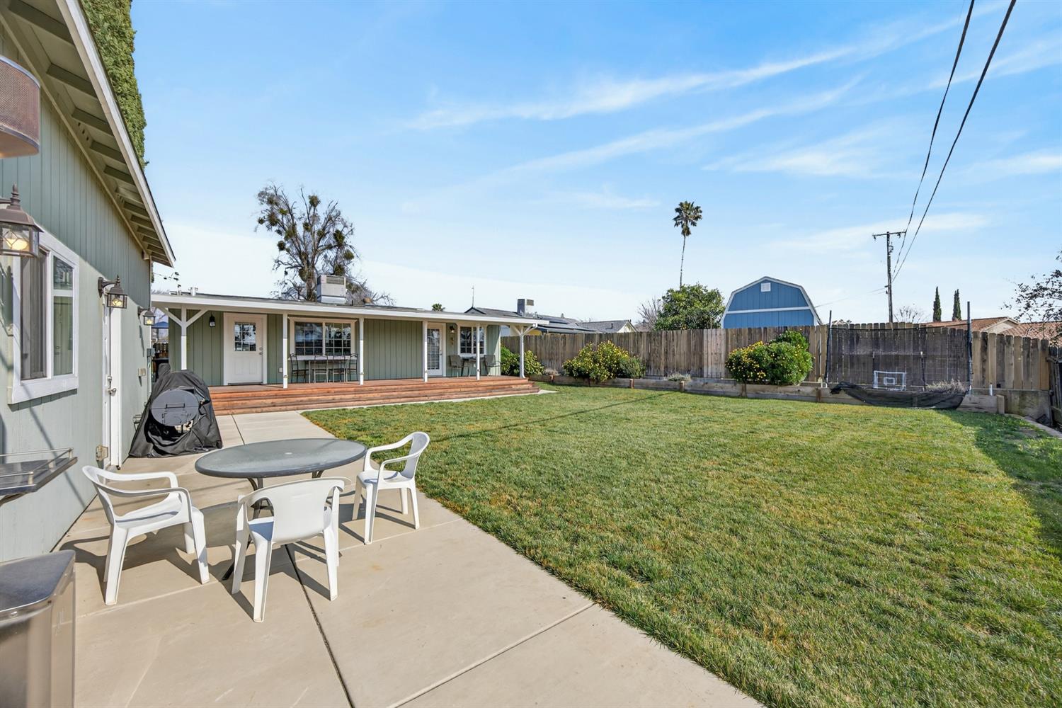 145 Oak Ridge Drive Ione, CA 95640 - Photo 14 of 61 a view of a house with backyard and a sitting area