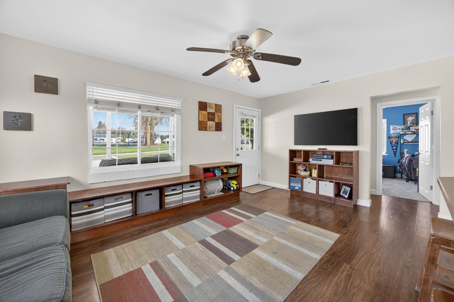 145 Oak Ridge Drive Ione, CA 95640 - Photo 27 of 61 a living room with furniture and a flat screen tv