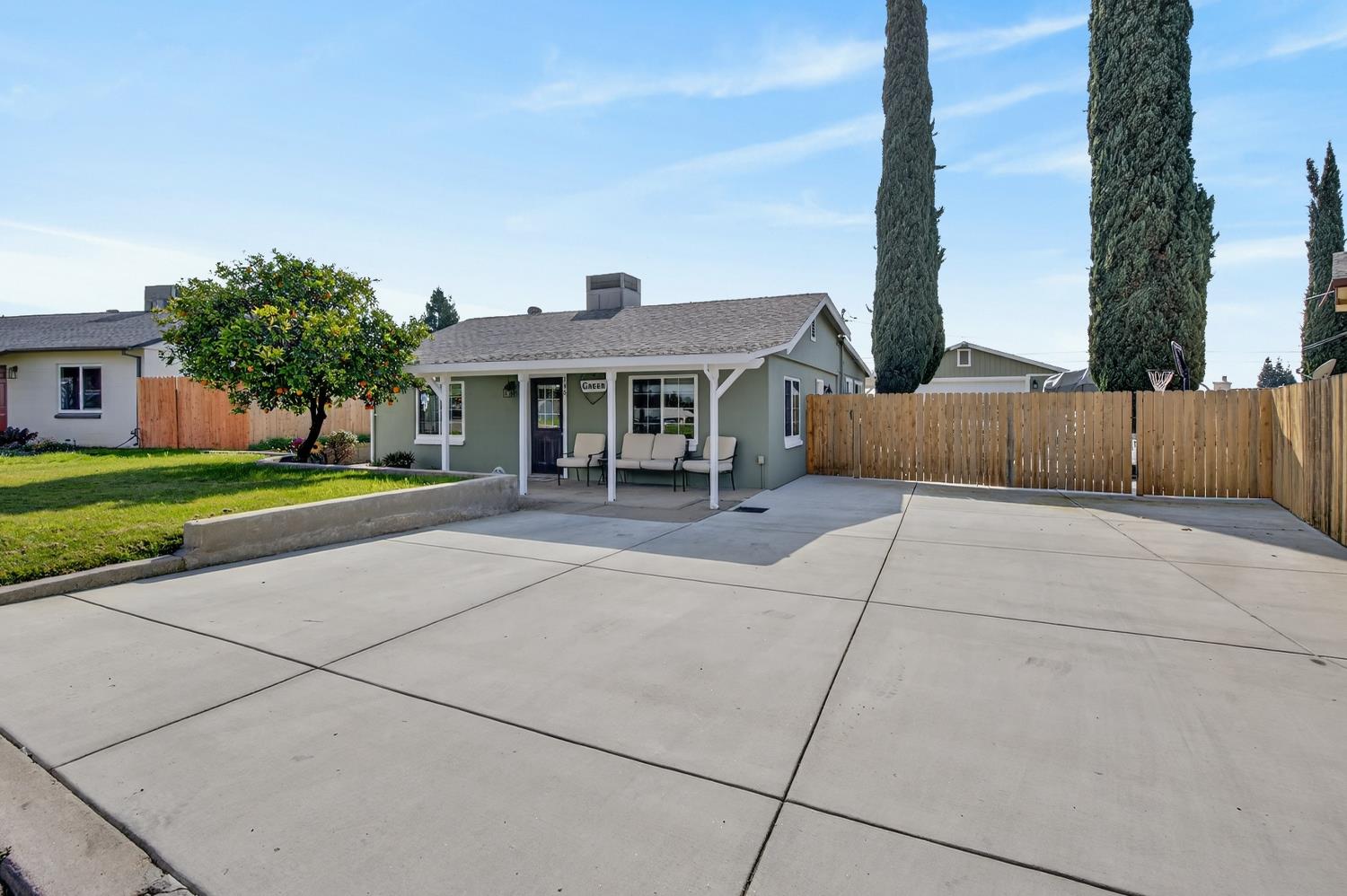 145 Oak Ridge Drive Ione, CA 95640 - Photo 3 of 61 a front view of a house with a yard