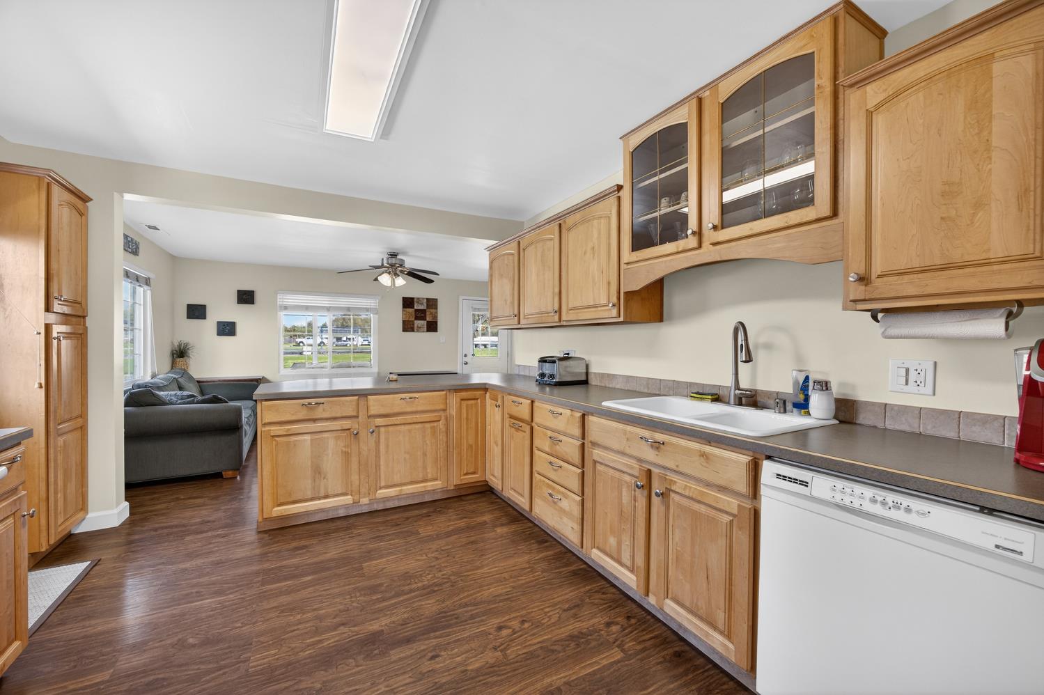 145 Oak Ridge Drive Ione, CA 95640 - Photo 31 of 61 a kitchen with a sink cabinets and wooden floor