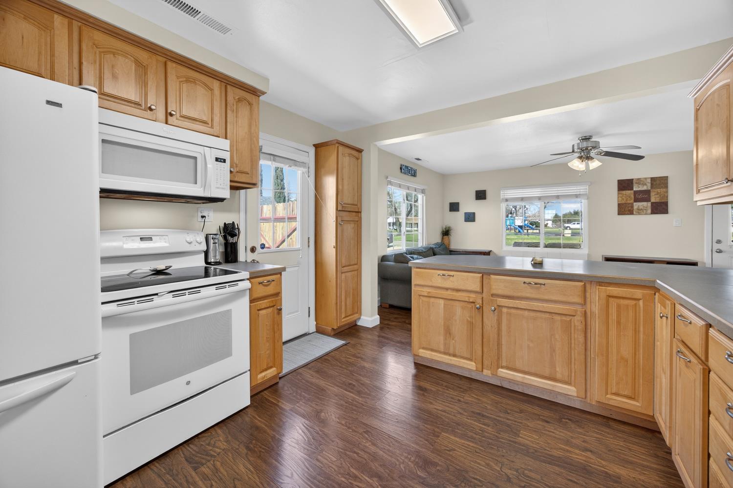 145 Oak Ridge Drive Ione, CA 95640 - Photo 32 of 61 a kitchen with stainless steel appliances granite countertop a stove a sink and a refrigerator