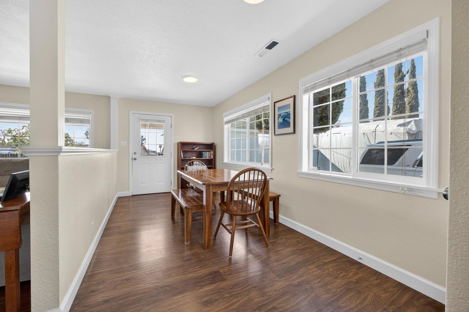 145 Oak Ridge Drive Ione, CA 95640 - Photo 34 of 61 a view of a dining room with furniture window and wooden floor