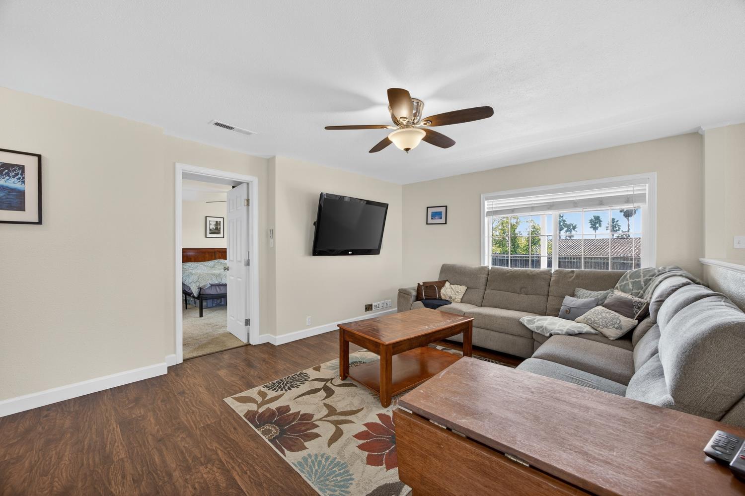 145 Oak Ridge Drive Ione, CA 95640 - Photo 38 of 61 a living room with furniture and a flat screen tv