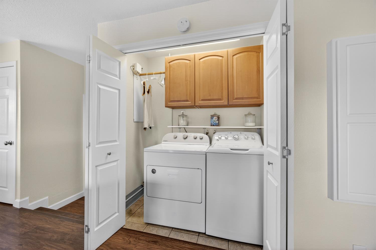 145 Oak Ridge Drive Ione, CA 95640 - Photo 41 of 61 a utility room with cabinets washer and dryer