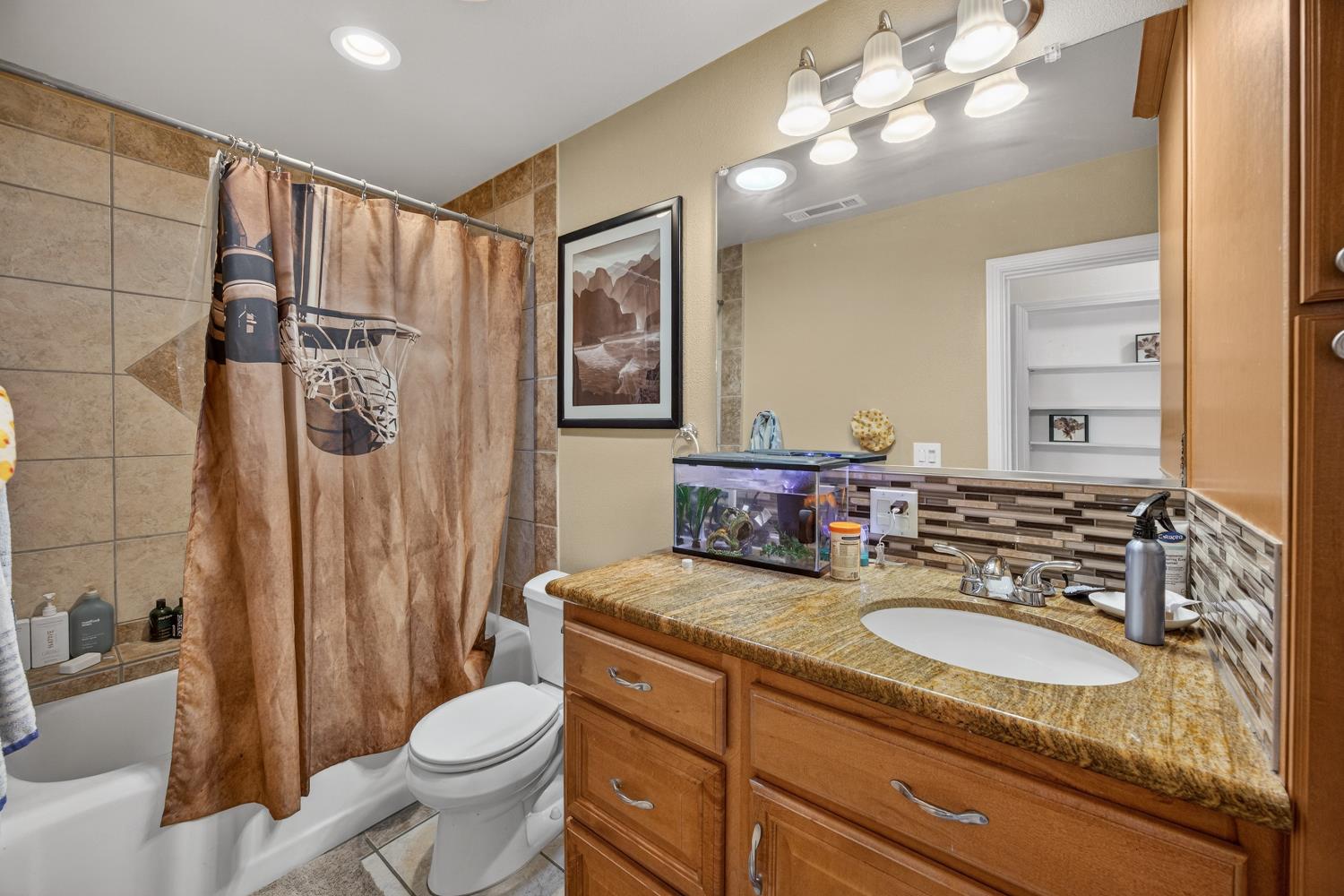145 Oak Ridge Drive Ione, CA 95640 - Photo 46 of 61 a bathroom with a toilet sink double vanity and mirror