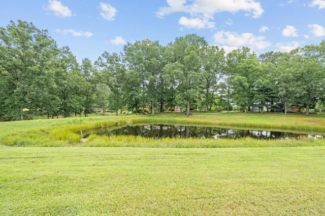 a view of a lake with a big yard