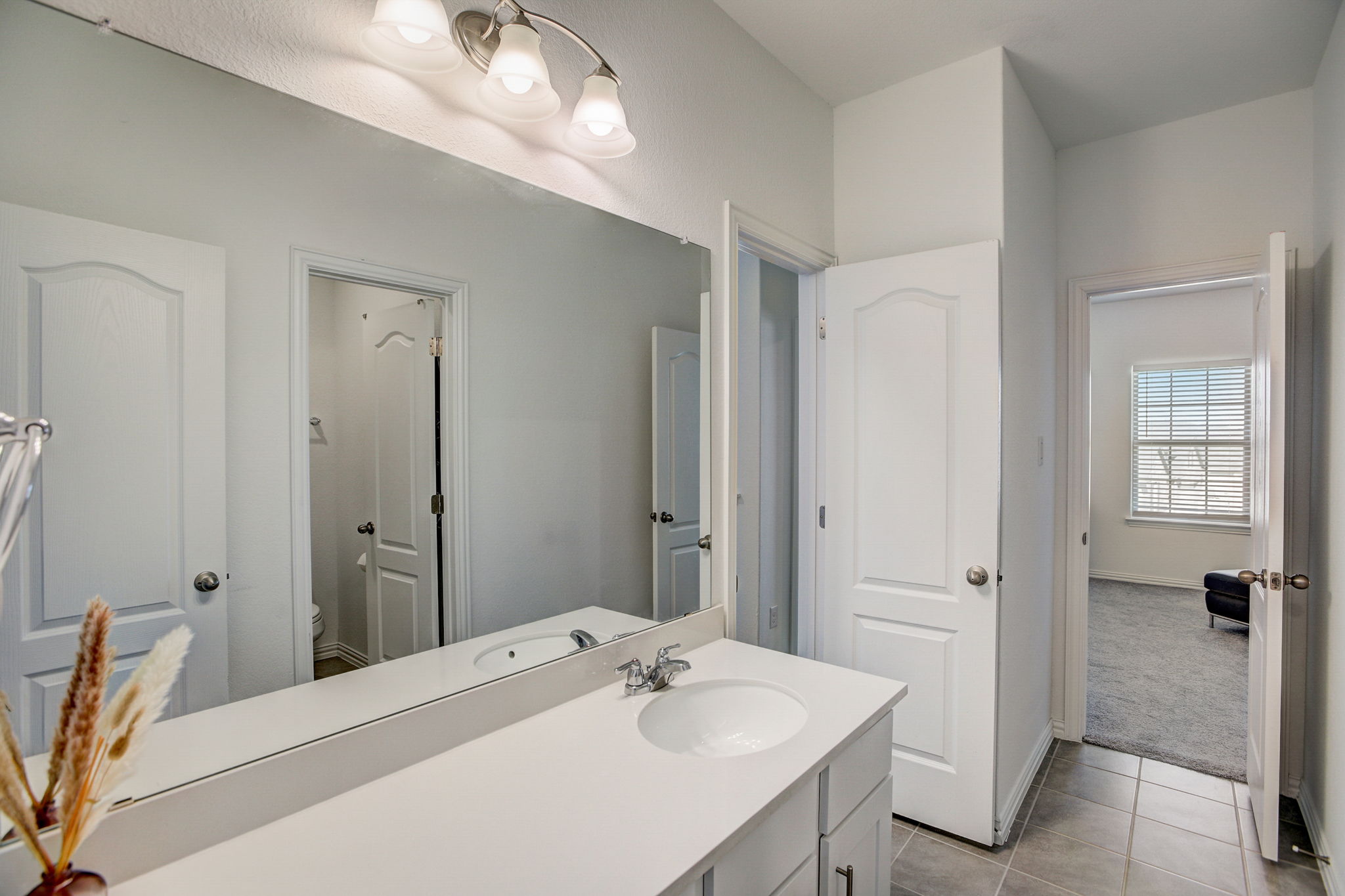 308 Monteforte Road Hutto, TX 78634 - Photo 22 of 32 a bathroom with a sink a toilet and shower