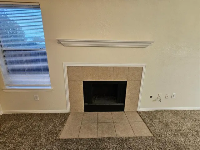a living room with a fireplace