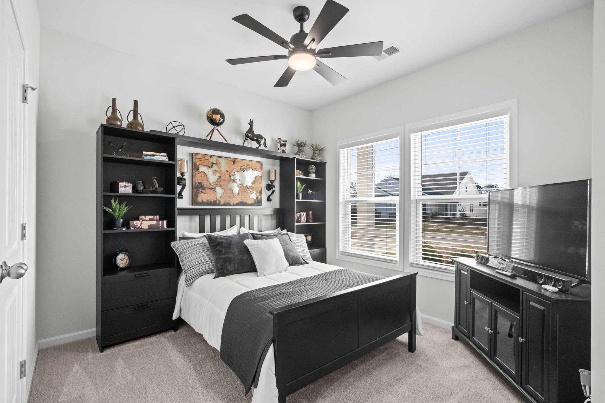 447 Honeyhill Loop Conway, SC 29526 - Photo 22 of 39 Bedroom with light colored carpet and ceiling fan