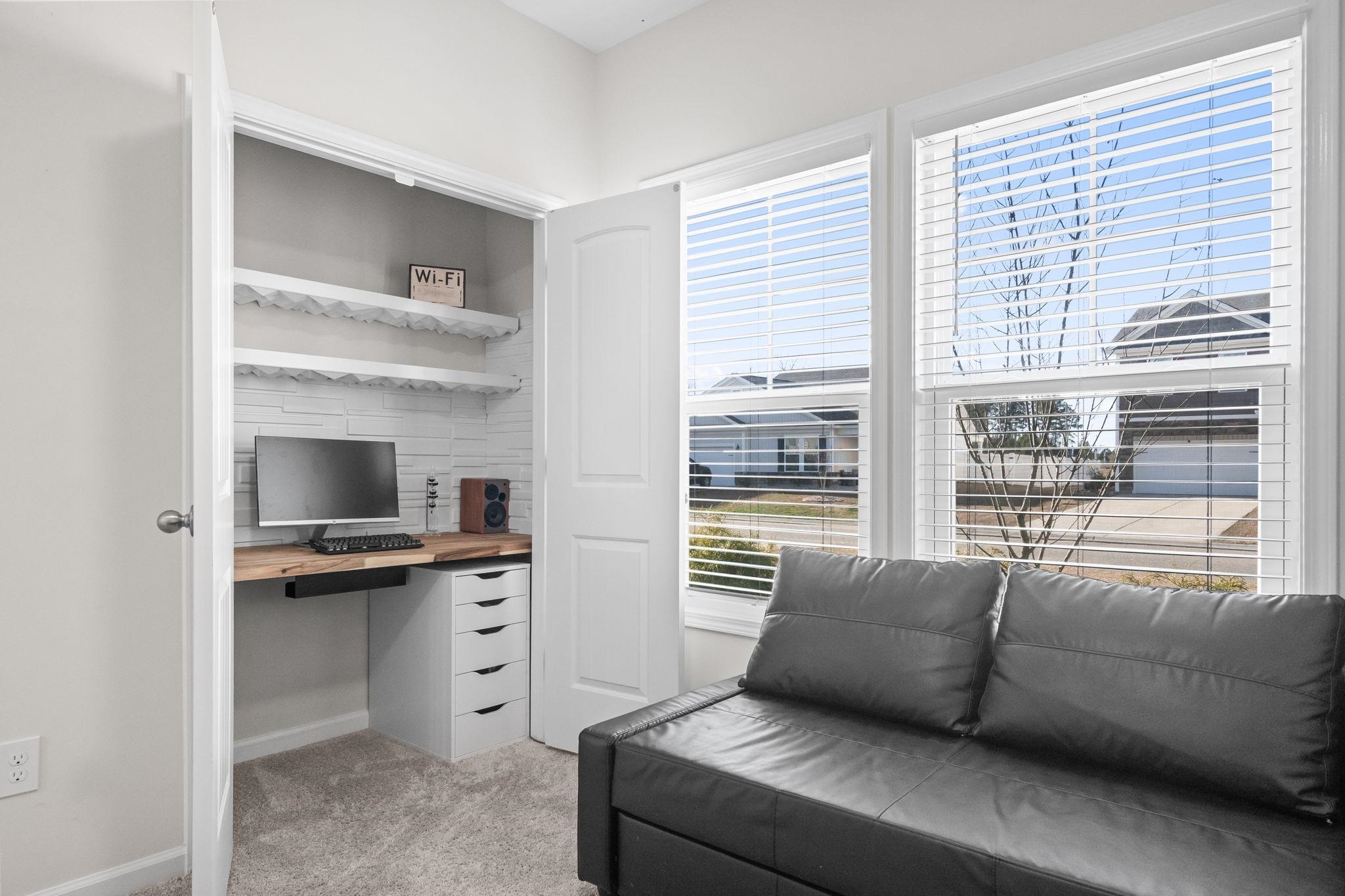 447 Honeyhill Loop Conway, SC 29526 - Photo 24 of 39 Home office featuring light colored carpet and built in study area