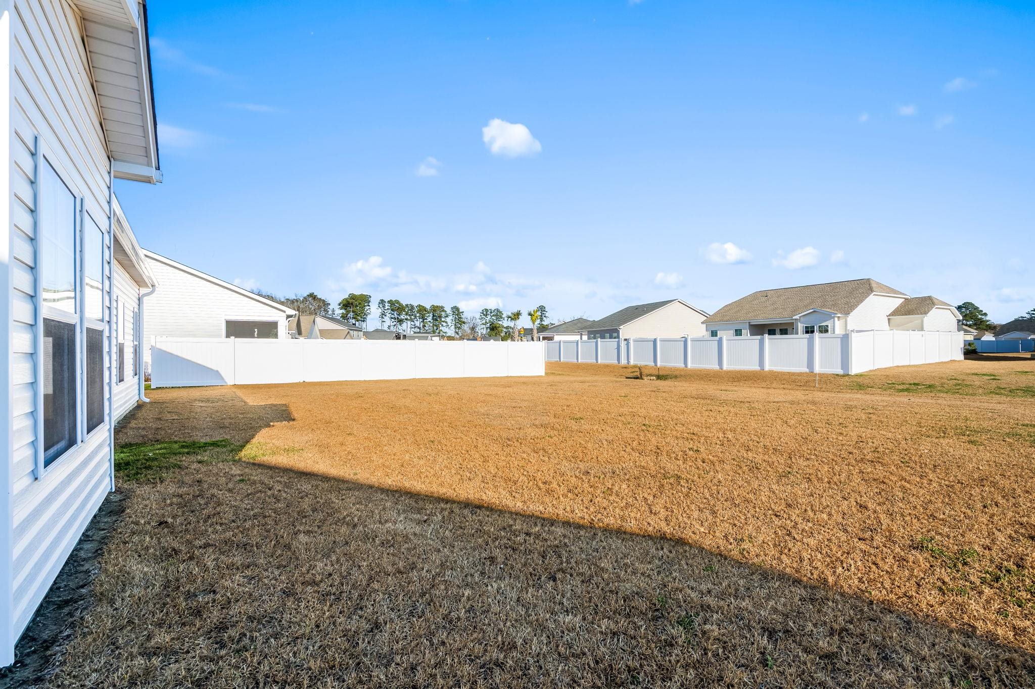 447 Honeyhill Loop Conway, SC 29526 - Photo 27 of 39 View of fenced backyard