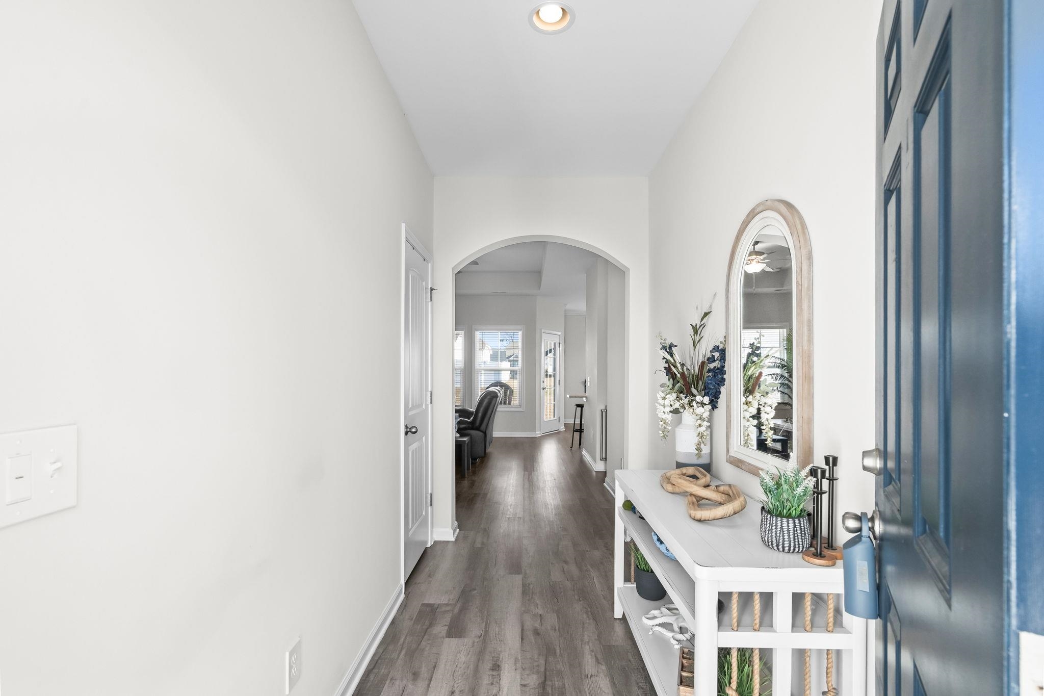 447 Honeyhill Loop Conway, SC 29526 - Photo 3 of 39 Foyer entrance with arched walkways, dark wood-style floors, and recessed lighting