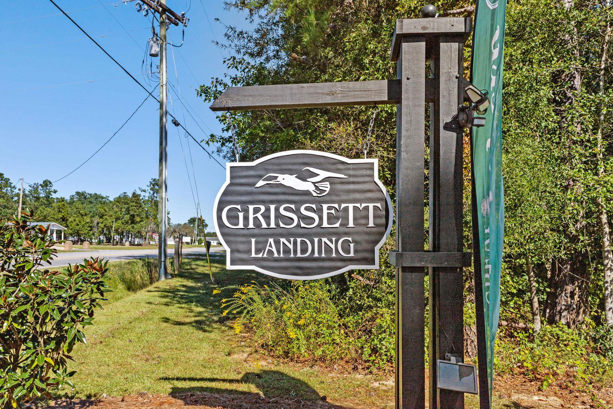 447 Honeyhill Loop Conway, SC 29526 - Photo 33 of 39 Community sign featuring a lawn