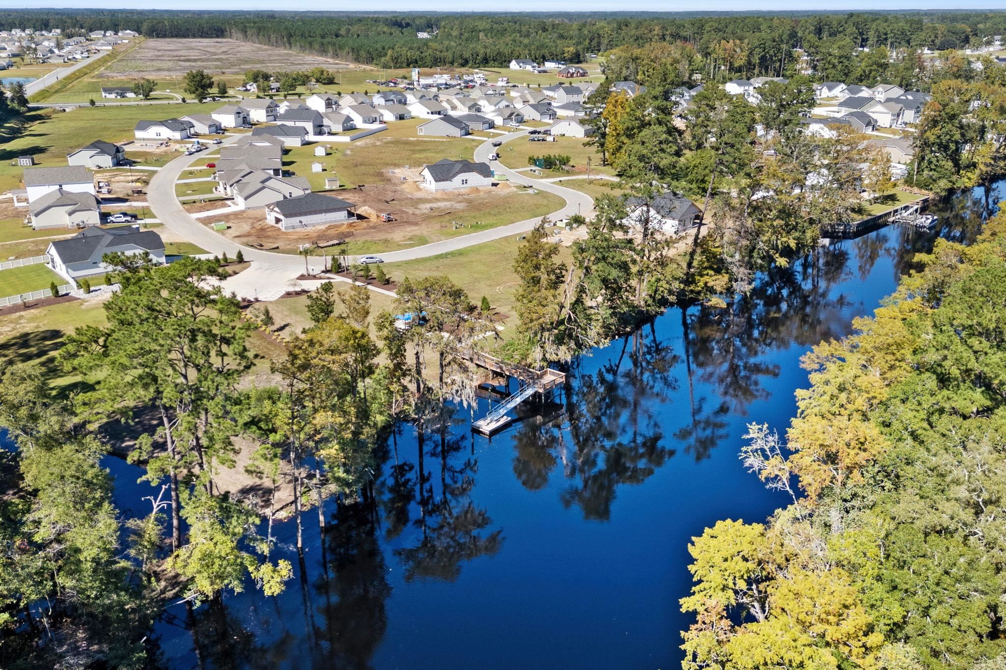 447 Honeyhill Loop Conway, SC 29526 - Photo 35 of 39 Aerial perspective of suburban area with a large body of water