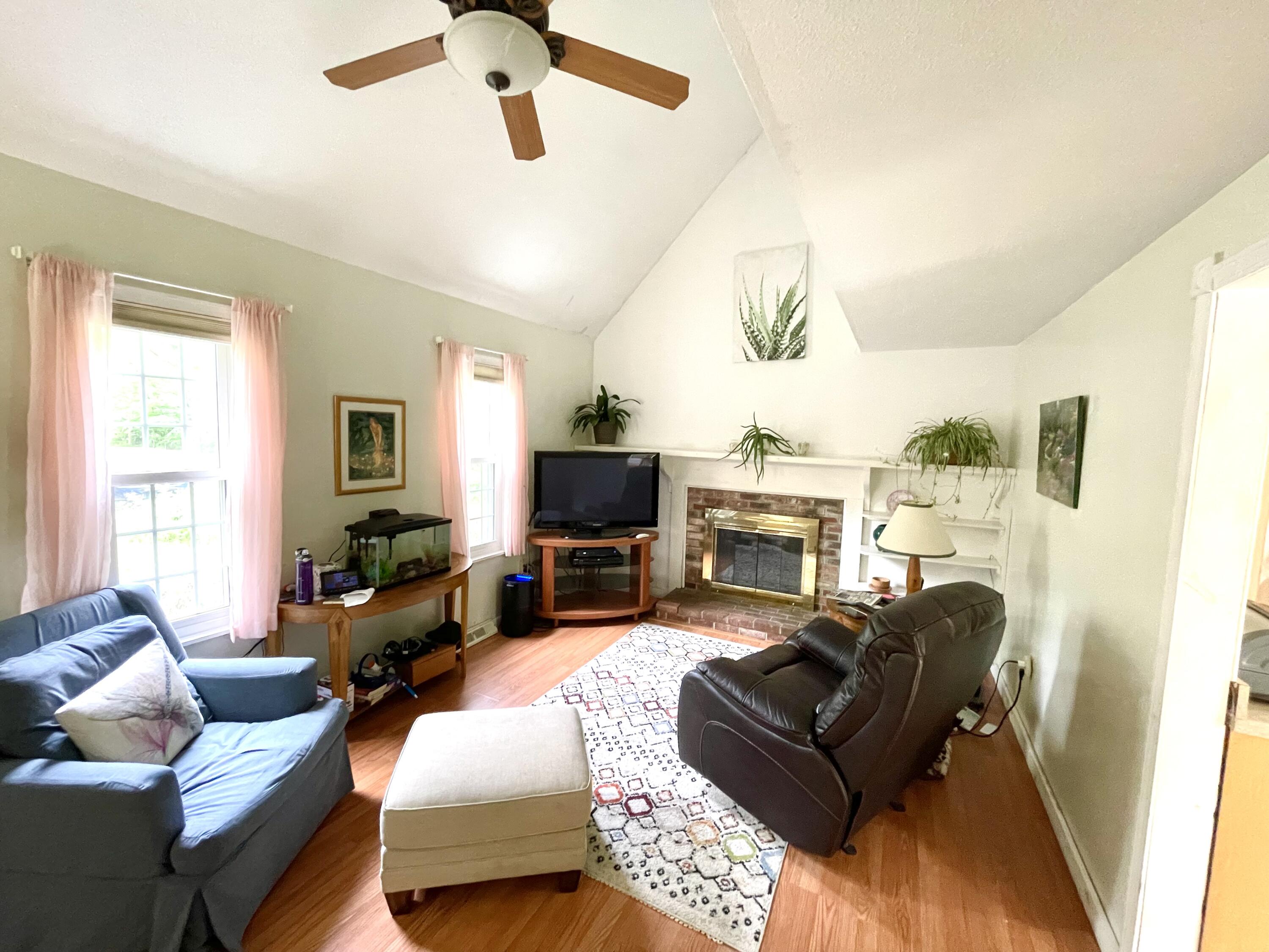 24 Fawn Road Mashpee, MA 02649 - Photo 12 of 23 a living room with furniture fireplace and a window