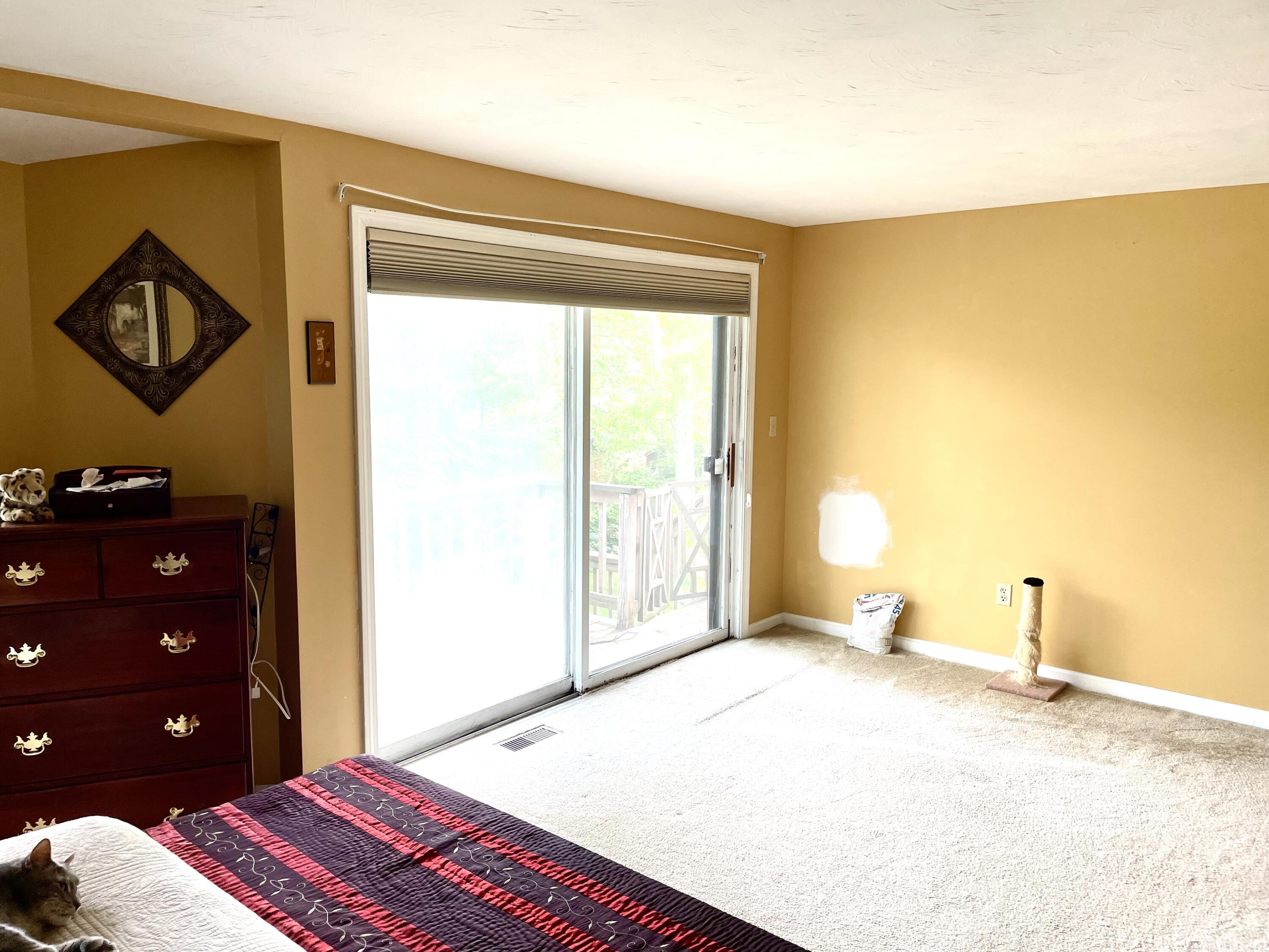 24 Fawn Road Mashpee, MA 02649 - Photo 15 of 23 a bedroom with a bed a lamp and a large window
