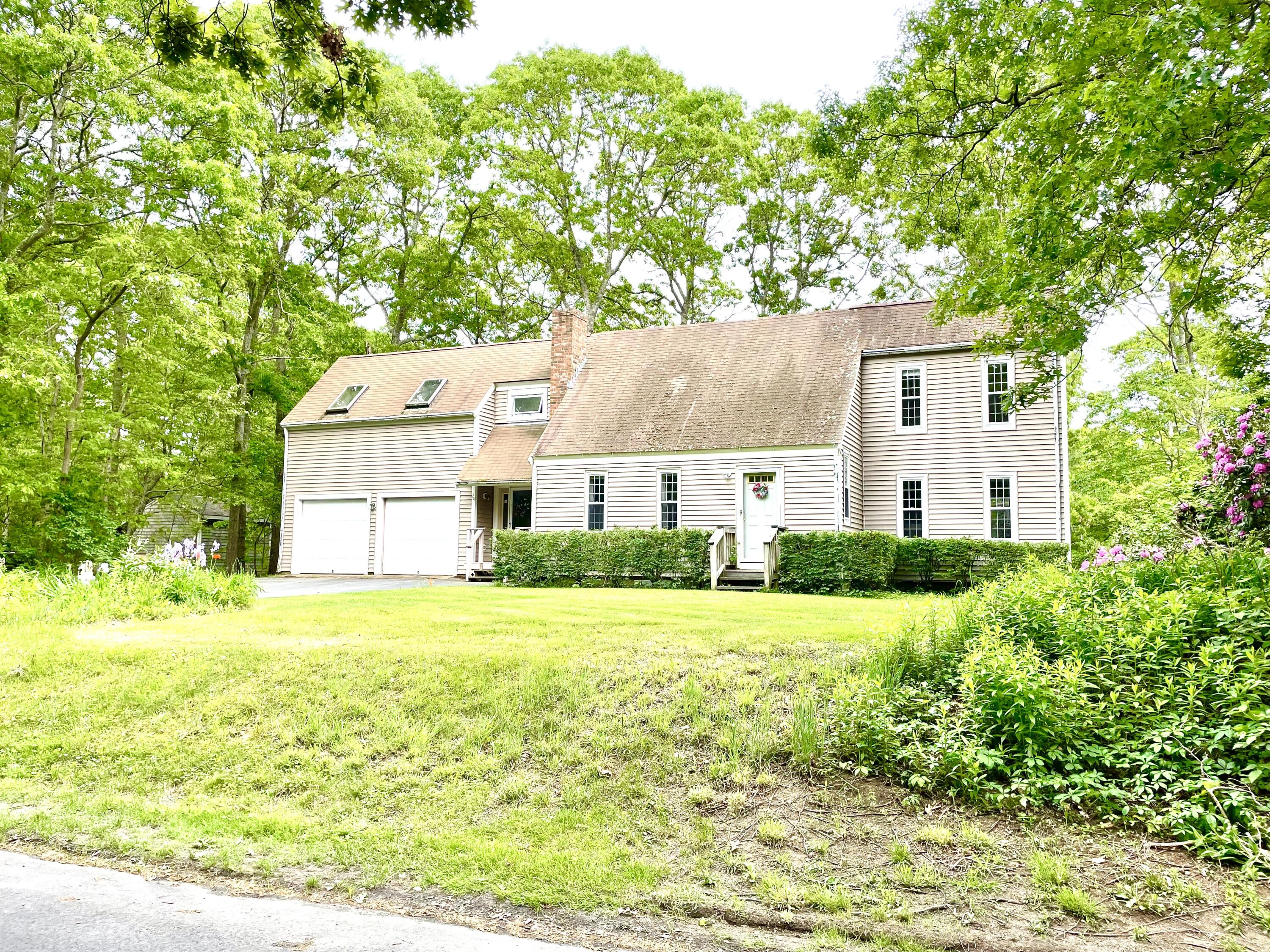 24 Fawn Road Mashpee, MA 02649 - Photo 2 of 23 a house view with a garden space
