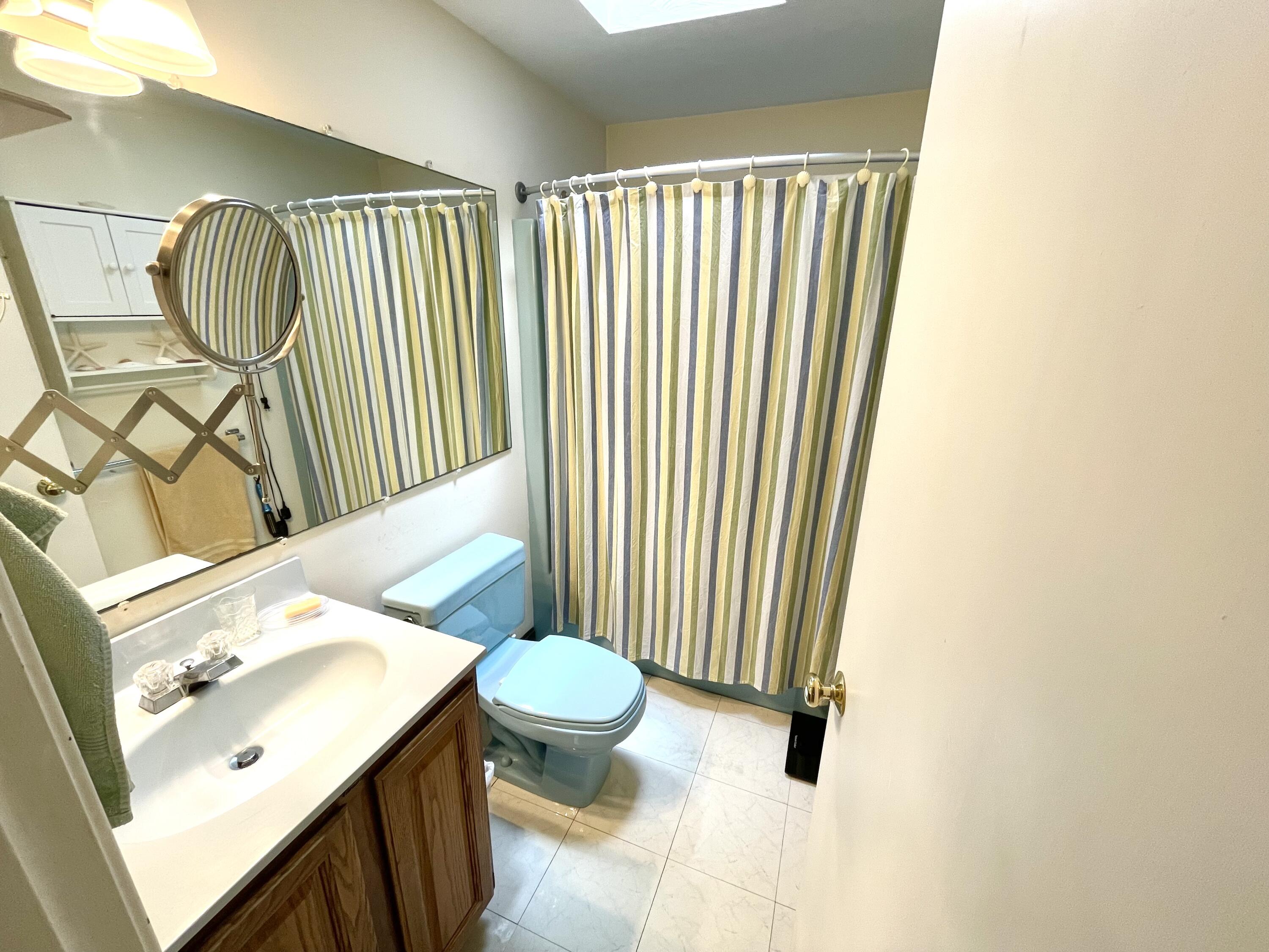 24 Fawn Road Mashpee, MA 02649 - Photo 21 of 23 a bathroom with a sink toilet and shower