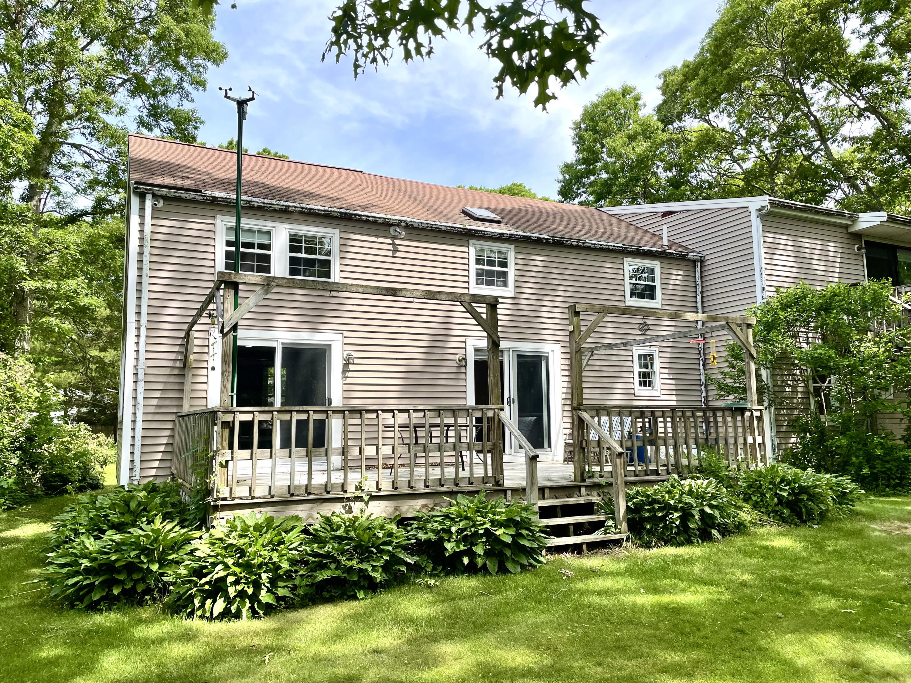 24 Fawn Road Mashpee, MA 02649 - Photo 5 of 23 a front view of a house with a yard