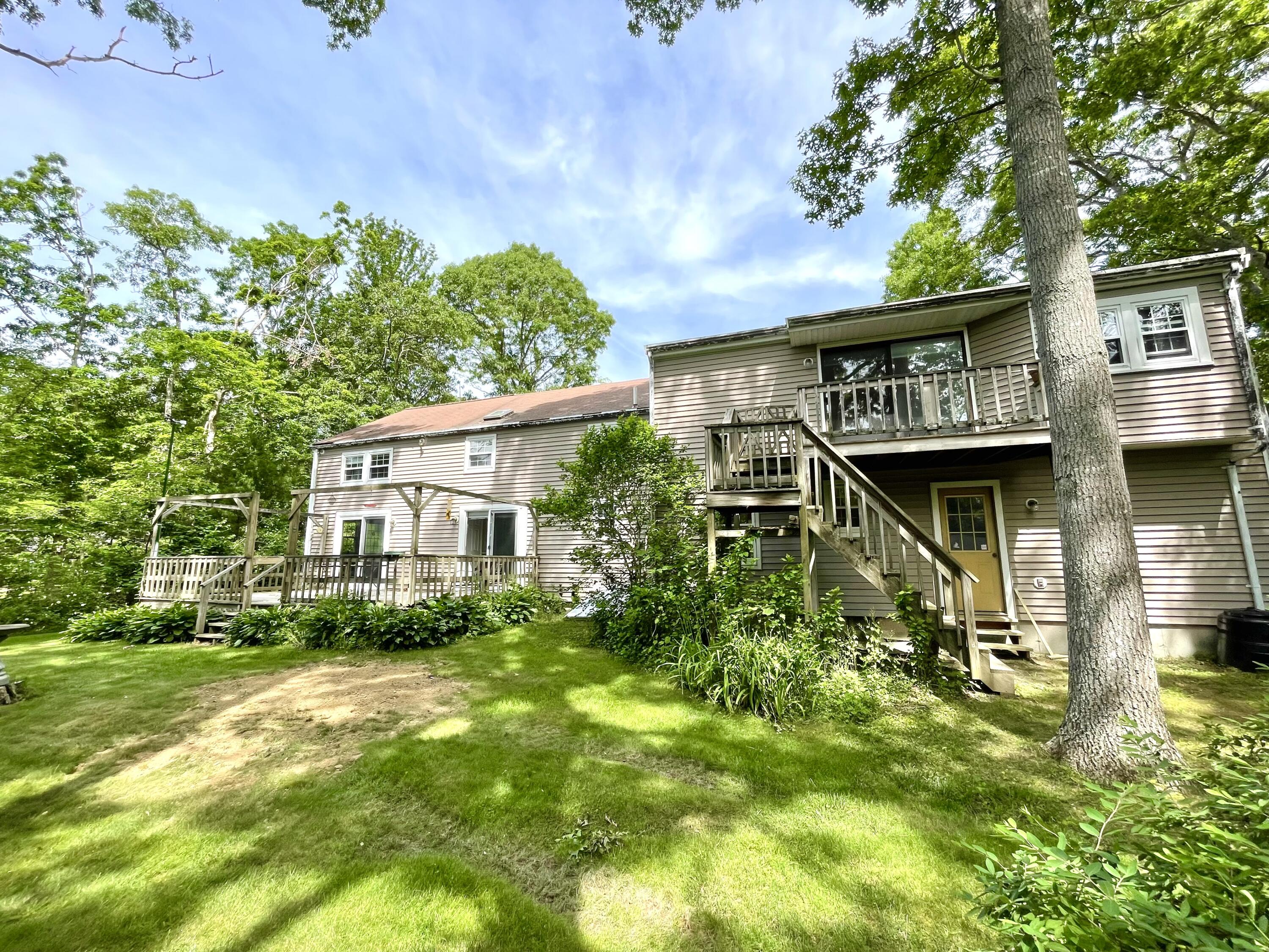 24 Fawn Road Mashpee, MA 02649 - Photo 6 of 23 front view of a house with a yard