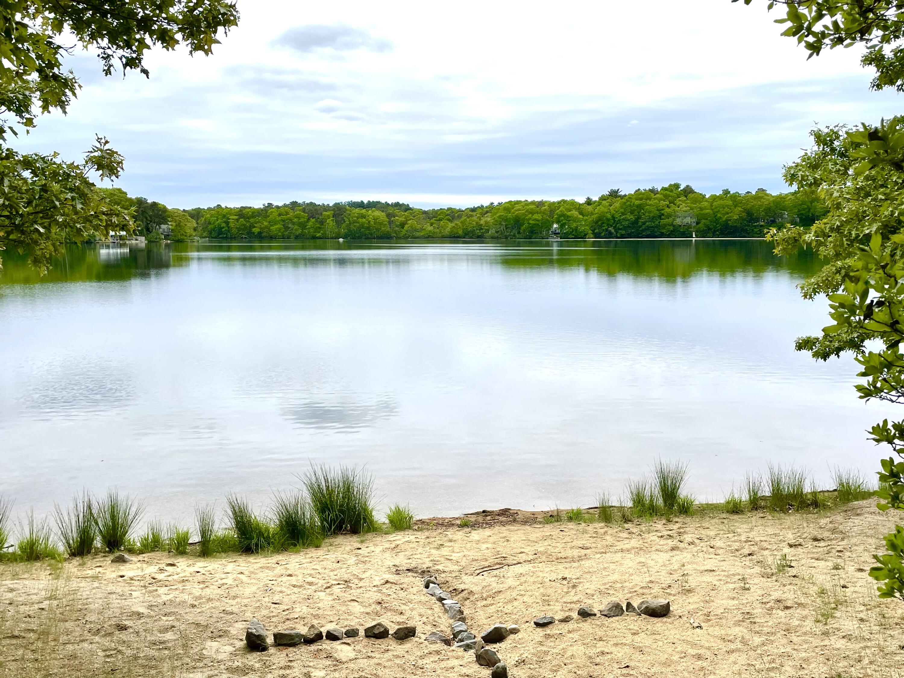 24 Fawn Road Mashpee, MA 02649 - Photo 8 of 23 a view of a lake with houses in the background