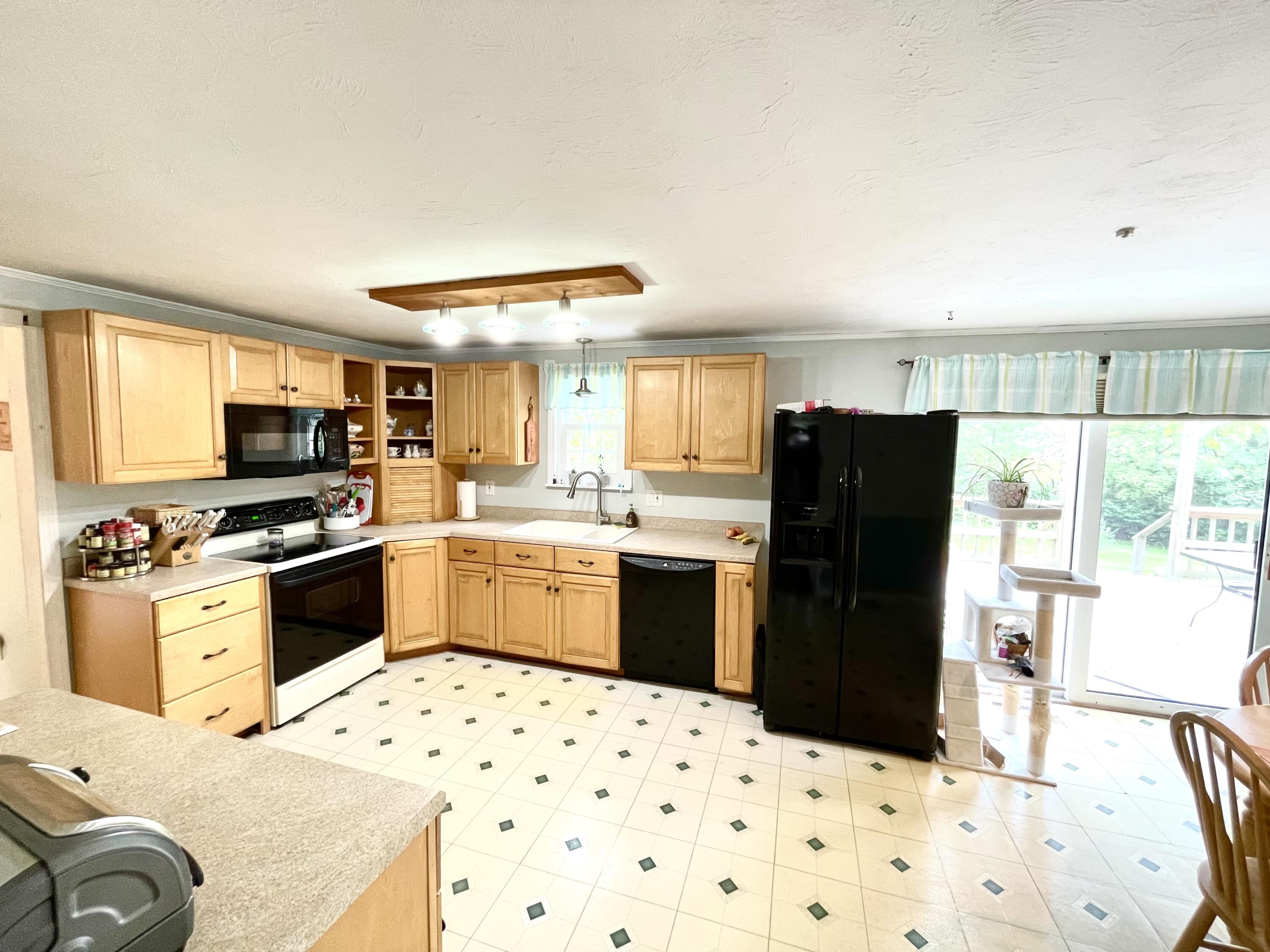 24 Fawn Road Mashpee, MA 02649 - Photo 9 of 23 a kitchen with granite countertop a refrigerator stove and sink