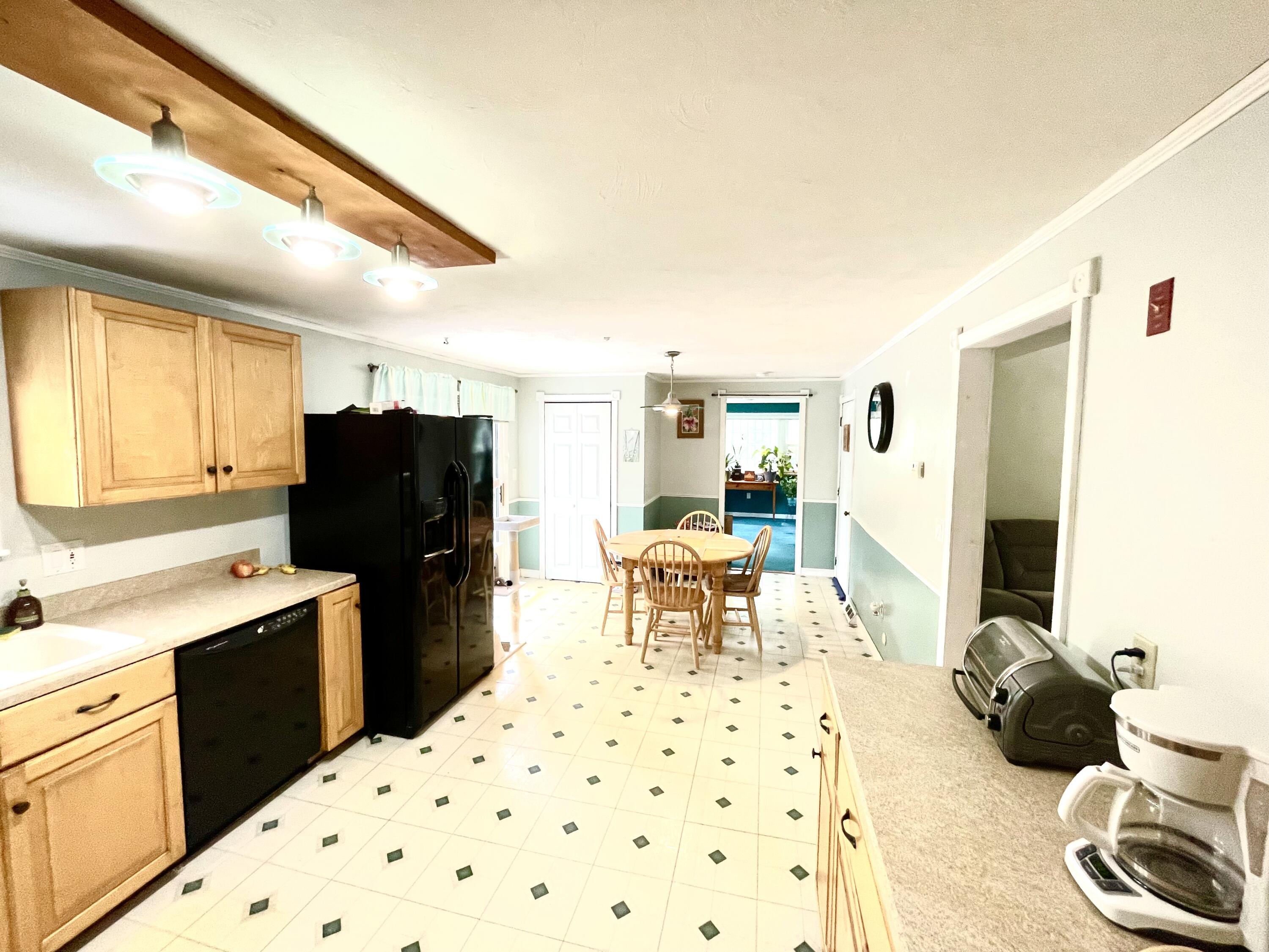 24 Fawn Road Mashpee, MA 02649 - Photo 10 of 23 a kitchen with a refrigerator and a stove top oven