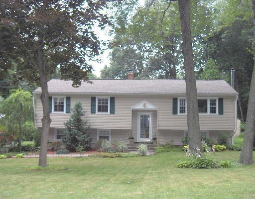 52 Benedict Road Bethel, CT 06801 - Photo 1 of 1 a front view of house with yard and trees
