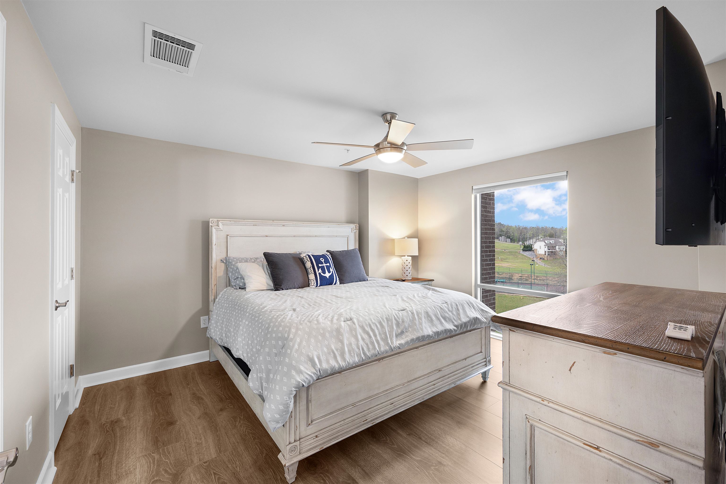 323 Cr 380 Road, Unit P 506 Iuka, MS 38852 - Photo 12 of 21 Bedroom with light wood-style floors and ceiling fan