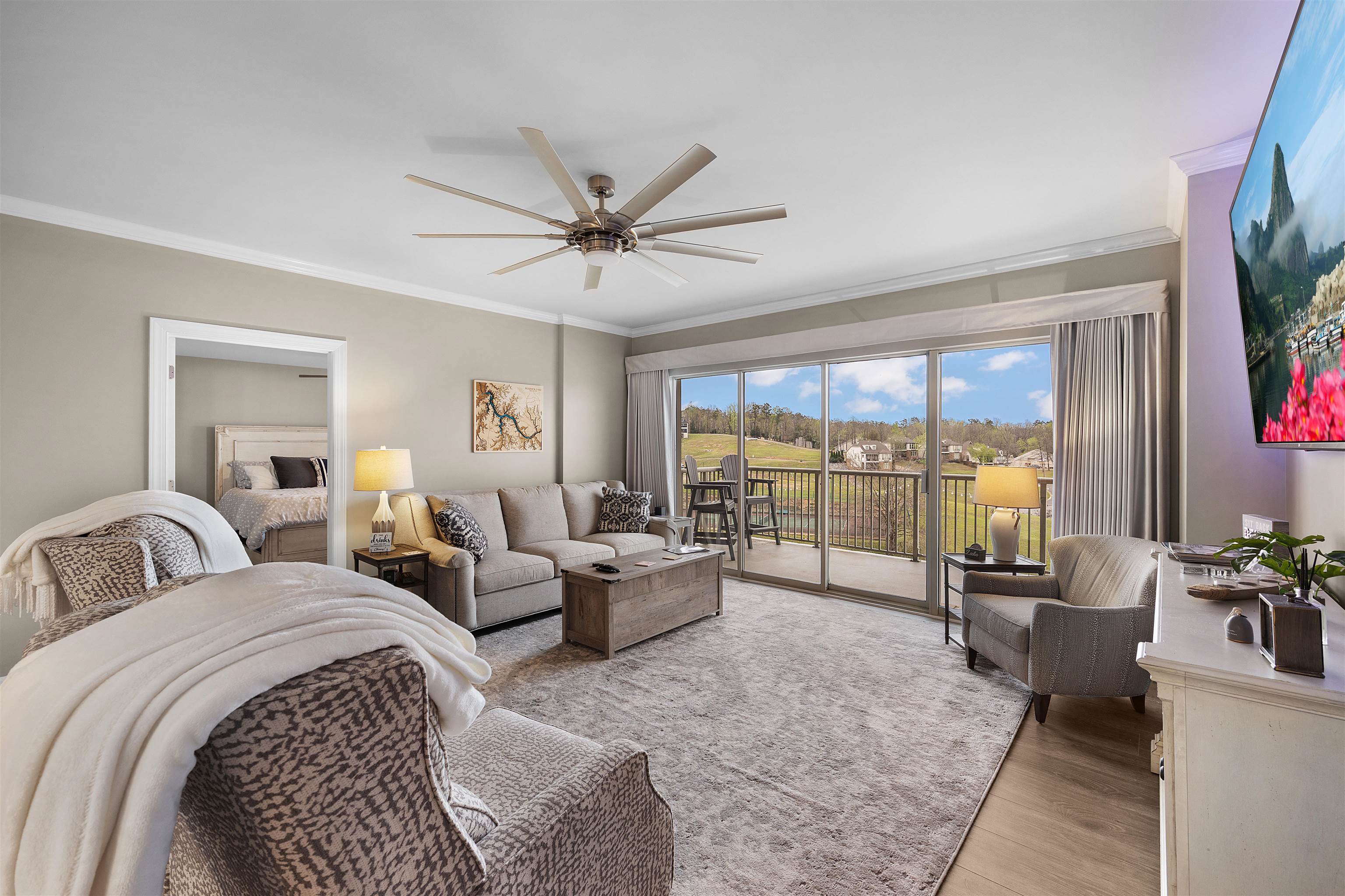 323 Cr 380 Road, Unit P 506 Iuka, MS 38852 - Photo 3 of 21 Living area featuring crown molding, ceiling fan, and light wood-type flooring