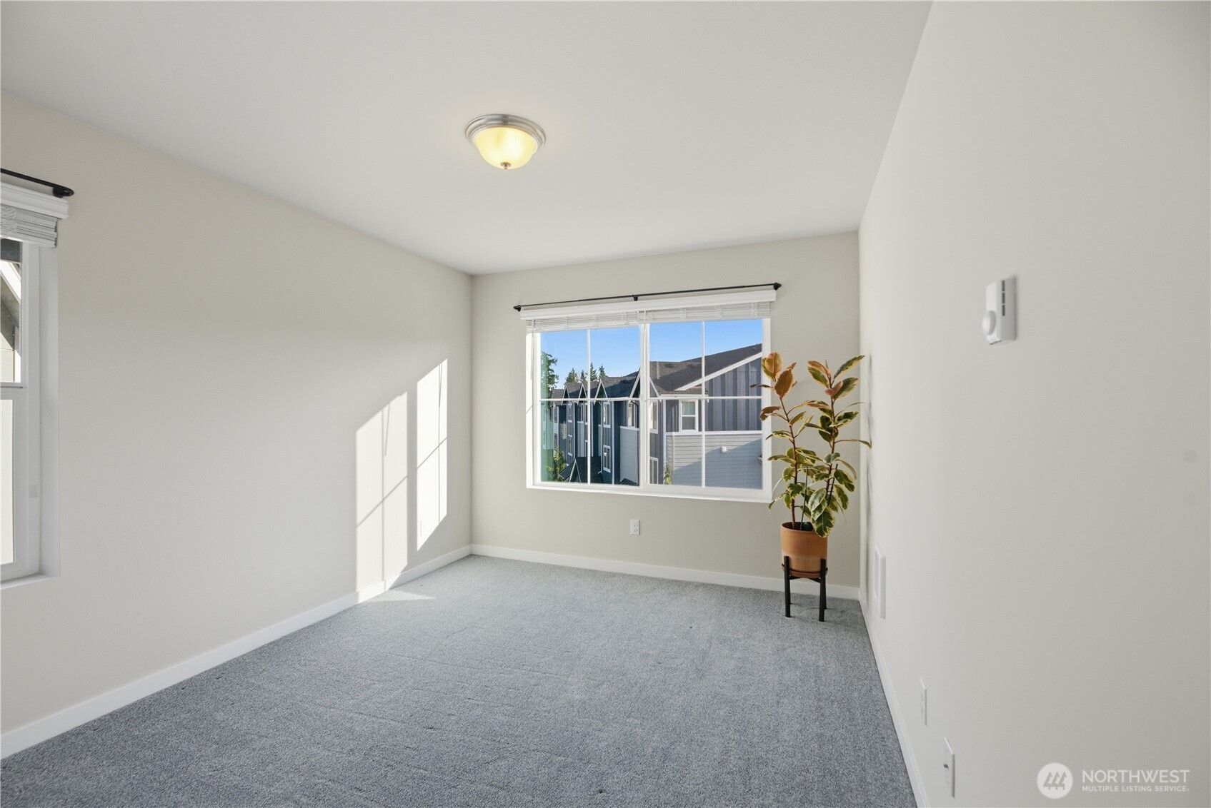 1621 Seattle Hill Road, Unit J5 Bothell, WA 98012 - Photo 33 of 40 a view of an empty room with a window