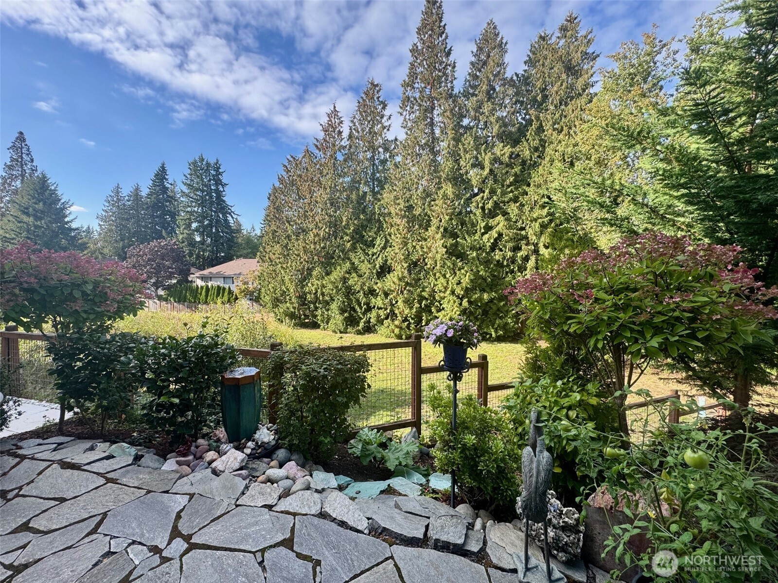 1621 Seattle Hill Road, Unit J5 Bothell, WA 98012 - Photo 39 of 40 a view of a large yard with plants and large trees