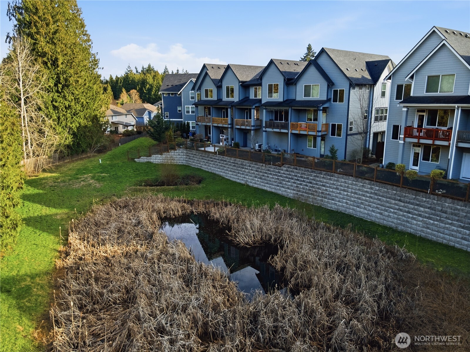 1621 Seattle Hill Road, Unit J5 Bothell, WA 98012 - Photo 4 of 40 a view of a big house with wooden fence