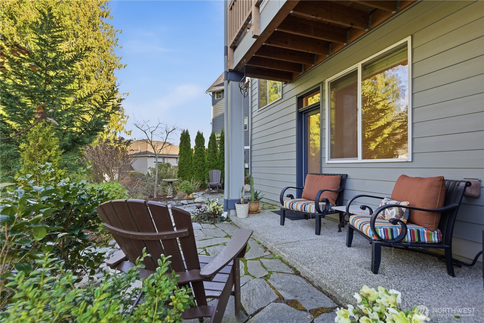 1621 Seattle Hill Road, Unit J5 Bothell, WA 98012 - Photo 7 of 40 a backyard of a house with barbeque oven table and chairs
