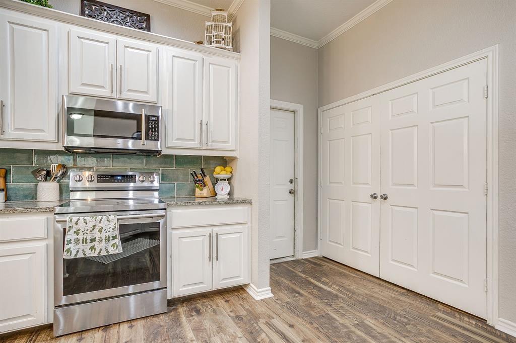 4017 Midway Road Weatherford, TX 76085 - Photo 12 of 40 Utility space is behind double doors