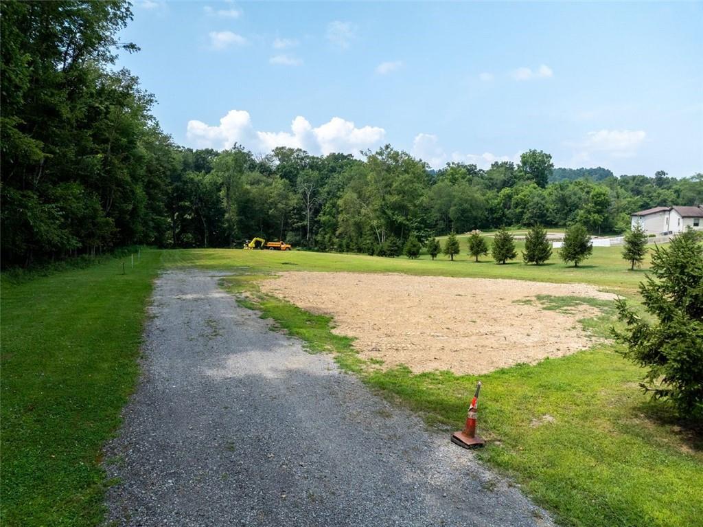 127 Britt Lane Butler, PA 16002 - Photo 2 of 11 a view of a big yard with large trees and plants